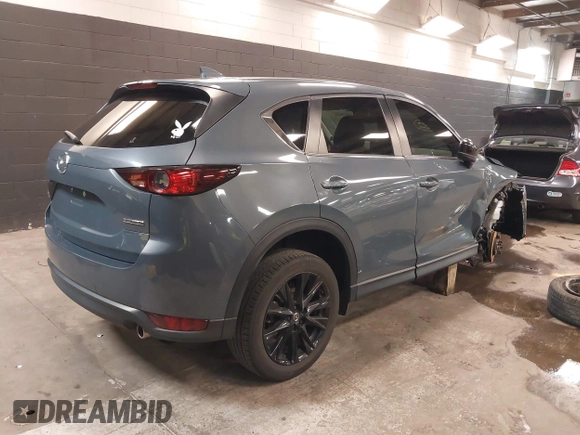 2021 Mazda CX-5 Touring with VIN JM3KFBCM5M0394707, listed as a IAAI auction lot 41887973 with 44,670 mi miles. Bid and sale history available at carsss.com. Image 4.