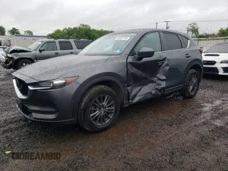 2020 Mazda CX-5 Touring z VIN JM3KFBCM2L0859412, wystawiony jako Copart lot #56422755 z przebiegiem 49 233 mil mil oraz Szkoda całkowita • Salvage title. Historia ofert i sprzedaży dostępna na DreamBid. Obrazek 1.