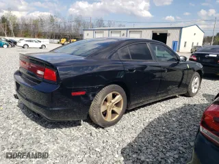 2014 Dodge Charger SE with VIN 2C3CDXBG9EH349301, listed as a Copart auction lot 54000015 with 210,349 mi miles and Clean Title. Bid and sale history available at carsss.com. Image 3.