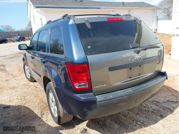 2010 Jeep Grand Cherokee Laredo with VIN 1J4PS4GK0AC112654, listed as a IAAI auction lot 41809445 with 418,301 mi miles. Bid and sale history available at carsss.com. Image 3.