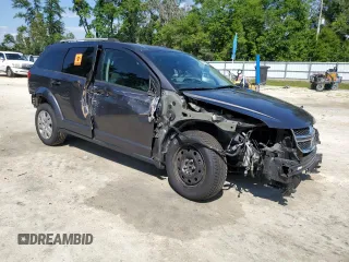 2017 Dodge Journey SE with VIN 3C4PDCAB6HT621987, listed as a Copart auction lot 52559305 with 169,468 mi miles and Salvage Title. Bid and sale history available at DreamBid. Image 4.