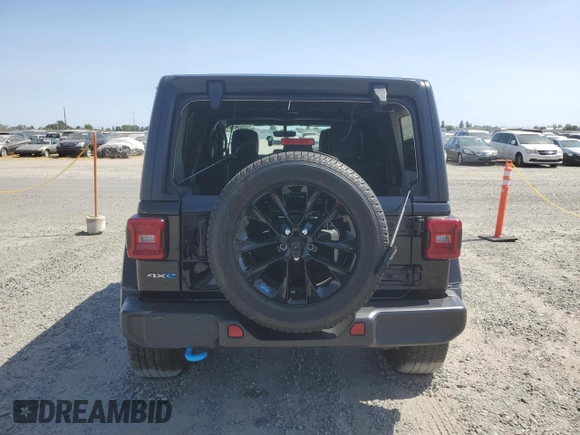 2023 Jeep Wrangler Sahara with VIN 1C4JJXP61PW512975, listed as a Copart auction lot 59392075 with 26,954 mi miles and Salvage title. Bid and sale history available at DreamBid. Image 6.