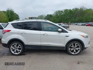 2016 Ford Escape Titanium with VIN 1FMCU9J96GUB97564, listed as a IAAI auction lot 42137663 with 269,009 mi miles. Bid and sale history available at carsss.com. Image 13.
