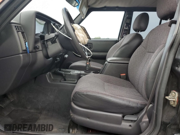 1999 Jeep Cherokee Sport with VIN 1J4FF68S7XL560943, listed as a Copart auction lot 58425505 with 68,654 mi miles and Salvage title. Bid and sale history available at DreamBid. Image 7.