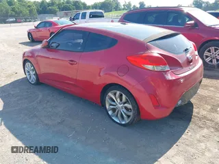 2012 Hyundai Veloster w/Black Int with VIN KMHTC6AD3CU032989, listed as a IAAI auction lot 42633748 with 137,727 mi miles and . Bid and sale history available at DreamBid. Image 3.
