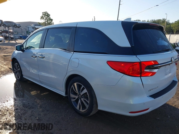 2022 Honda Odyssey Touring with VIN 5FNRL6H85NB058948, listed as a IAAI auction lot 42579157 with 53,669 mi miles and . Bid and sale history available at DreamBid. Image 3.