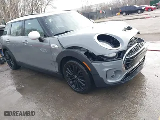 2017 MINI Clubman Cooper S with VIN WMWLU5C59H2E83705, listed as a IAAI auction lot 41853702 with 135,905 mi miles. Bid and sale history available at carsss.com. Image 1.