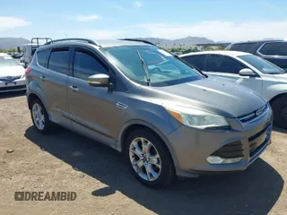 2013 Ford Escape SEL with VIN 1FMCU9H92DUB31689, listed as a IAAI auction lot 42022387 with 74,343 mi miles. Bid and sale history available at carsss.com. Image 1.