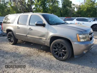 2007 Chevrolet Suburban LS with VIN 1GNFC16097J403193, listed as a Copart auction lot 51236075 with 191,350 mi miles and Salvage title. Bid and sale history available at DreamBid. Image 4.