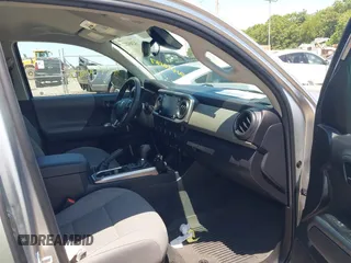 2023 Toyota Tacoma SR with VIN 3TYCZ5AN2PT141576, listed as a IAAI auction lot 42492127 with 43,431 mi miles and . Bid and sale history available at DreamBid. Image 5.