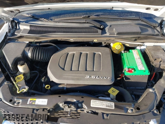 2014 Dodge Grand Caravan SE with VIN 2C4RDGBG1ER220534, listed as a IAAI auction lot 41262990 with 77,851 mi miles and . Bid and sale history available at DreamBid. Image 10.