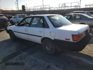 1990 Toyota Camry z VIN JT2SV21E3L0349179, wystawiony jako Copart lot #75125234 z przebiegiem 138 635 mil mil oraz Czysty tytuł • Clean title. Historia ofert i sprzedaży dostępna na DreamBid. Obrazek 2.