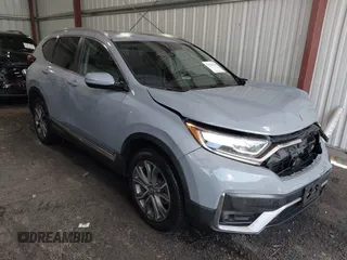2020 Honda CR-V Touring with VIN 2HKRW2H90LH608435, listed as a IAAI auction lot 42318256 with 32,602 mi miles and . Bid and sale history available at DreamBid. Image 1.