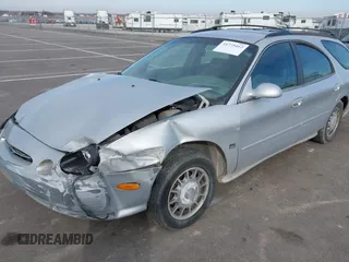 1999 Ford Taurus SE z VIN 1FAFP58S4XA299009, wystawiony jako IAAI lot #41775412 z przebiegiem 80 634 mil mil oraz . Historia ofert i sprzedaży dostępna na DreamBid. Obrazek 2.