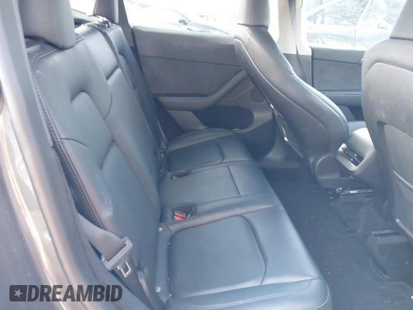 2023 Tesla Model Y Long Range with VIN 7SAYGDEE1PA053215, listed as a IAAI auction lot 41476973 with 58,025 mi miles and . Bid and sale history available at DreamBid. Image 8.