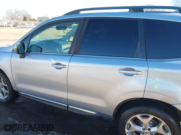 2017 Subaru Forester Touring with VIN JF2SJAWC8HH532348, listed as a IAAI auction lot 41304804 with 104,221 mi miles and . Bid and sale history available at DreamBid. Image 14.