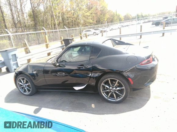 2021 Mazda MX-5 Miata Grand Touring z VIN JM1NDAM75M0451597, wystawiony jako IAAI lot #41932712 z przebiegiem 61 710 mil mil oraz . Historia ofert i sprzedaży dostępna na DreamBid. Obrazek 14.