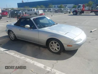 1991 Mazda MX-5 Miata Special Edition z VIN JM1NA3511M1235948, wystawiony jako IAAI lot #42322754 z przebiegiem 151 065 mil mil oraz . Historia ofert i sprzedaży dostępna na DreamBid. Obrazek 1.