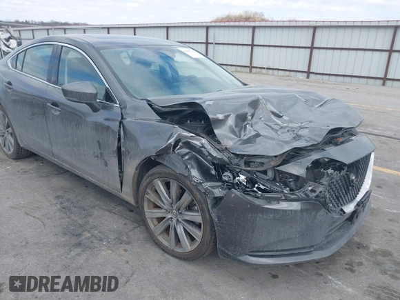 2020 Mazda 6 Grand Touring with VIN JM1GL1TY6L1525169, listed as a IAAI auction lot 41683512 with 73,313 mi miles and . Bid and sale history available at DreamBid. Image 1.