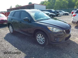 2014 Mazda CX-5 Touring with VIN JM3KE2CY2E0380478, listed as a IAAI auction lot 42406443 with 91,220 mi miles and . Bid and sale history available at DreamBid. Image 1.