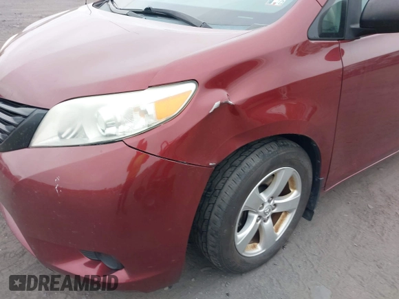 2014 Toyota Sienna L z VIN 5TDZK3DC2ES505680, wystawiony jako IAAI lot #42307763 z przebiegiem 170 628 mil mil oraz . Historia ofert i sprzedaży dostępna na DreamBid. Obrazek 6.