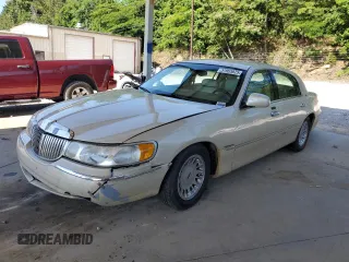 2002 Lincoln Town Car Cartier with VIN 1LNHM83W12Y653166, listed as a Copart auction lot 57965825 with 185,586 mi miles and Salvage title. Bid and sale history available at DreamBid. Image 1.