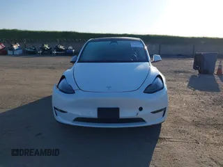 2023 Tesla Model Y Long Range with VIN 7SAYGDEE3PF817097, listed as a IAAI auction lot 41767294 with 64,047 mi miles and . Bid and sale history available at DreamBid. Image 13.