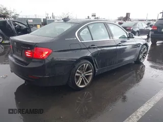 2013 BMW 3 Series ActiveHybrid 3 with VIN WBA3F9C57DF483994, listed as a IAAI auction lot 41797778 with 92,313 mi miles. Bid and sale history available at carsss.com. Image 4.
