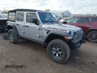2021 Jeep Wrangler Unlimited Rubicon with VIN 1C4HJXFNXMW560512, listed as a IAAI auction lot 42124812 with 18,034 mi miles and . Bid and sale history available at DreamBid. Image 1.