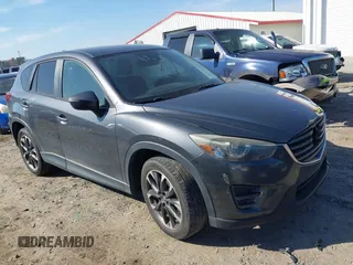 2016 Mazda CX-5 Grand Touring with VIN JM3KE4DY8G0823567, listed as a IAAI auction lot 41784384 with 143,836 mi miles and . Bid and sale history available at carsss.com. Image 1.