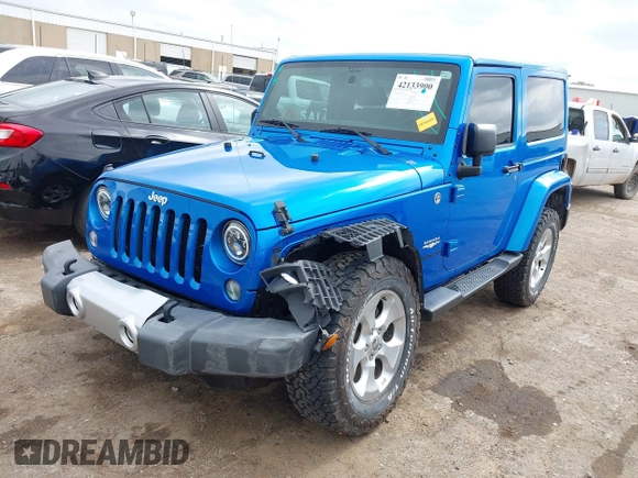 2015 Jeep Wrangler Sahara with VIN 1C4AJWBG9FL663959, listed as a IAAI auction lot 42133900 with 56,253 mi miles and . Bid and sale history available at DreamBid. Image 2.