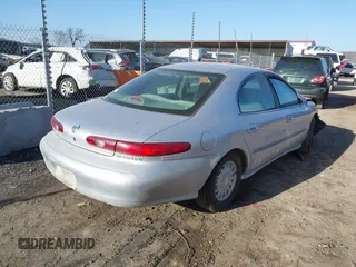 1996 Mercury Sable GS with VIN 1MELM50U5TA633365, listed as a IAAI auction lot 41723519 with 144,067 mi miles. Bid and sale history available at carsss.com. Image 4.