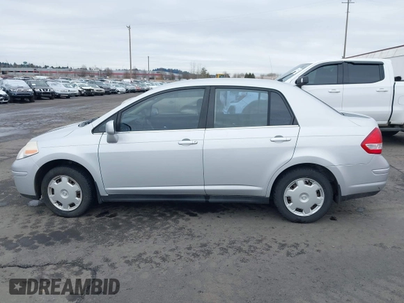 2007 Nissan Versa 1.8 SL with VIN 3N1BC11E97L447829, listed as a IAAI auction lot 41612386 with 123,500 mi miles. Bid and sale history available at carsss.com. Image 14.