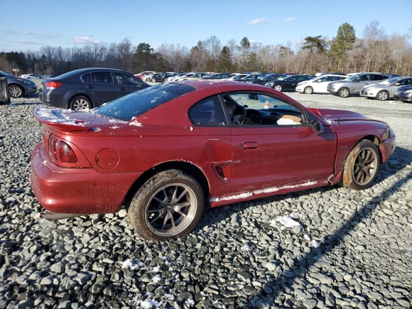 1996 Ford Mustang GT z VIN 1FALP42X0TF168223, wystawiony jako Copart lot #46351085 z przebiegiem 121 657 mil mil oraz Szkoda całkowita • Salvage title. Historia ofert i sprzedaży dostępna na DreamBid. Obrazek 3.