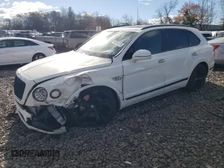 2019 Bentley Bentayga V8 z VIN SJAAM2ZV2KC024354, wystawiony jako Copart lot #80264914 z przebiegiem 54 513 mil mil oraz Szkody całkowita. Historia ofert i sprzedaży dostępna na DreamBid. Obrazek 1.