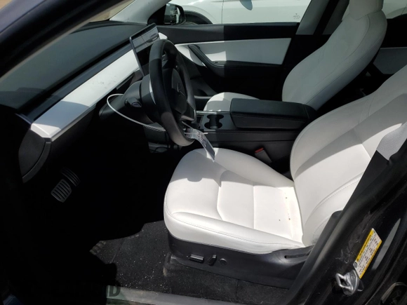 2021 Tesla Model Y Performance with VIN 5YJYGDEF0MF137692, listed as a Copart auction lot 55333395 with 56,325 mi miles and Salvage Title. Bid and sale history available at DreamBid. Image 7.