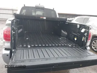 2018 Toyota Tacoma SR with VIN 5TFGZ5AN4JX142565, listed as a IAAI auction lot 41353718 with 87,544 mi miles and . Bid and sale history available at carsss.com. Image 16.