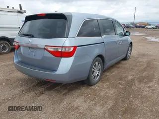 2011 Honda Odyssey EX-L with VIN 5FNRL5H64BB085479, listed as a IAAI auction lot 42404637 with 185,624 mi miles and . Bid and sale history available at DreamBid. Image 4.