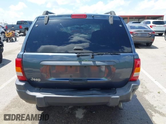 2004 Jeep Grand Cherokee Laredo with VIN 1J4GX48S44C205469, listed as a IAAI auction lot 42310571 with 154,929 mi miles and . Bid and sale history available at DreamBid. Image 16.