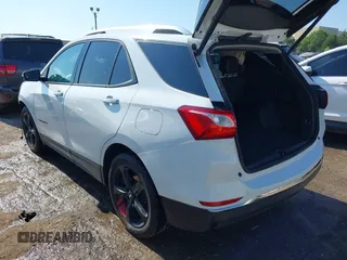 2021 Chevrolet Equinox Premier z VIN 2GNAXNEV9M6120241, wystawiony jako IAAI lot #42222928 z przebiegiem 104 274 mil mil oraz . Historia ofert i sprzedaży dostępna na DreamBid. Obrazek 3.