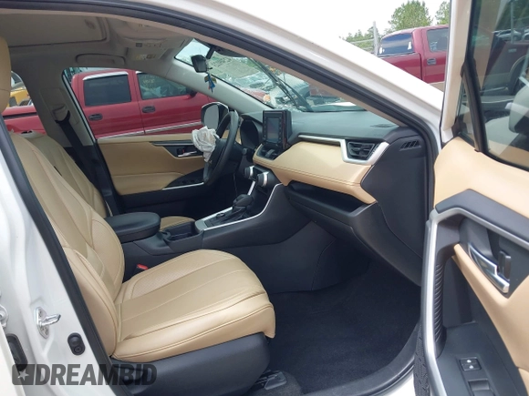 2020 Toyota RAV4 Hybrid XLE with VIN 2T3RWRFV5LW094731, listed as a IAAI auction lot 42349123 with 60,927 mi miles and . Bid and sale history available at DreamBid. Image 5.
