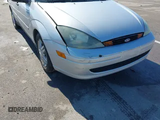 2004 Ford Focus SE with VIN 1FAFP34394W120884, listed as a IAAI auction lot 41663180 with 213,972 mi miles and . Bid and sale history available at DreamBid. Image 6.