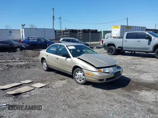 2002 Saturn SL z VIN 1G8ZH52812Z167587, wystawiony jako IAAI lot #42000992 z przebiegiem 104 894 mil mil oraz . Historia ofert i sprzedaży dostępna na DreamBid. Obrazek 1.