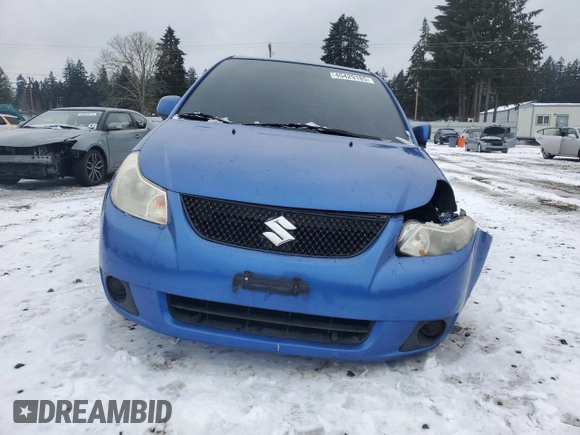 2012 Suzuki SX4 LE z VIN JS2YC5A30C6305375, wystawiony jako Copart lot #45429185 z przebiegiem 103 283 mil mil oraz Szkoda całkowita • Salvage title. Historia ofert i sprzedaży dostępna na DreamBid. Obrazek 5.