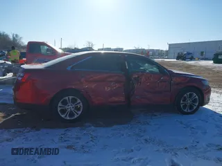 2015 Ford Taurus SEL z VIN 1FAHP2E85FG163421, wystawiony jako IAAI lot #41320489 z przebiegiem 165 618 mil mil oraz . Historia ofert i sprzedaży dostępna na DreamBid. Obrazek 13.