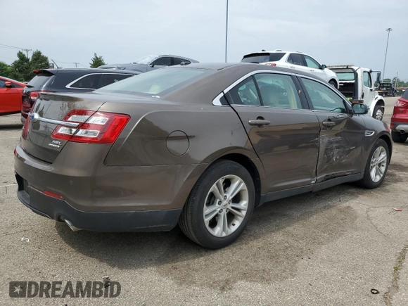 2015 Ford Taurus SEL with VIN 1FAHP2E89FG193926, listed as a Copart auction lot 61036375 with 23,963 mi miles and Salvage title. Bid and sale history available at DreamBid. Image 3.
