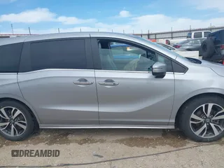 2021 Honda Odyssey Touring with VIN 5FNRL6H8XMB034837, listed as a IAAI auction lot 41856444 with 84,950 mi miles. Bid and sale history available at carsss.com. Image 13.