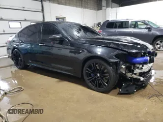 2018 BMW M5 z VIN WBSJF0C51JB282271, wystawiony jako Copart lot #60647265 z przebiegiem 63 765 mil mil oraz Szkoda całkowita • Salvage title. Historia ofert i sprzedaży dostępna na DreamBid. Obrazek 4.