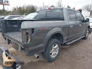 2015 Ford F-150 XLT with VIN 1FTEW1EG8FKE38679, listed as a IAAI auction lot 41526976 with 137,000 mi miles. Bid and sale history available at carsss.com. Image 4.