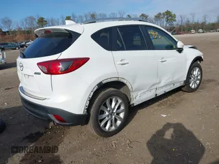 2014 Mazda CX-5 Grand Touring with VIN JM3KE4DY7E0425201, listed as a IAAI auction lot 41803597 with 118,867 mi miles. Bid and sale history available at carsss.com. Image 4.
